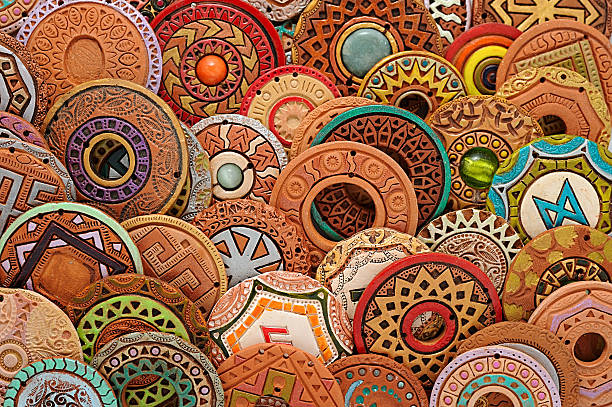 These handcrafted clay bells, adorned with colorful strings, are perfect for decoration and gifting