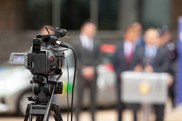 istock Press conference. Covering an event with a video camera. 492253196