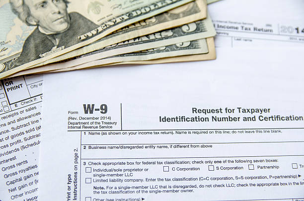 istock W-9 Form Request for Taxpayer Indentification Number, Certification with dollar 492253696