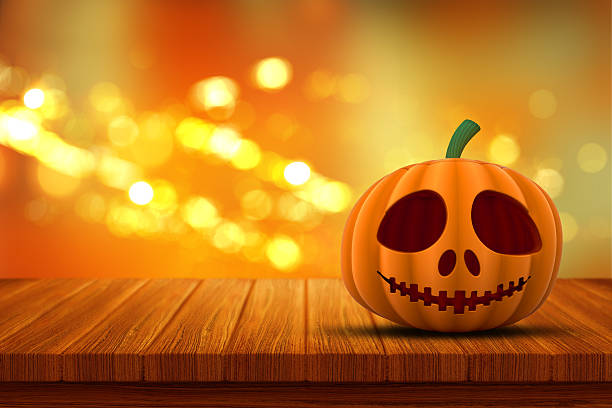 istock 3D Halloween pumpkin on a wooden table 492258920