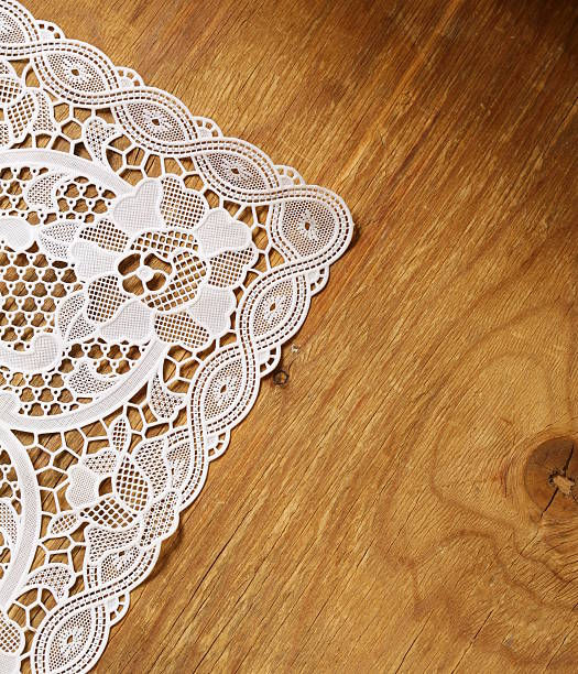 istock old wooden background with white lace napkin 492259157