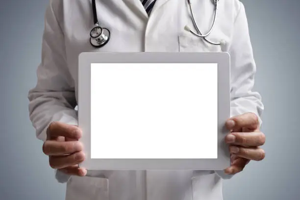 Photo of Doctor showing blank digital tablet screen