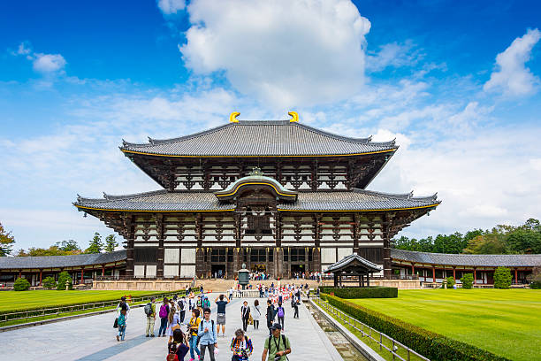 Nara, Japan - October 6, 2015: Todaiji's main hall, known as the Daibutsuden in Nara, Japan. People walking the main footpath. Popular tourist destination and religious location. 