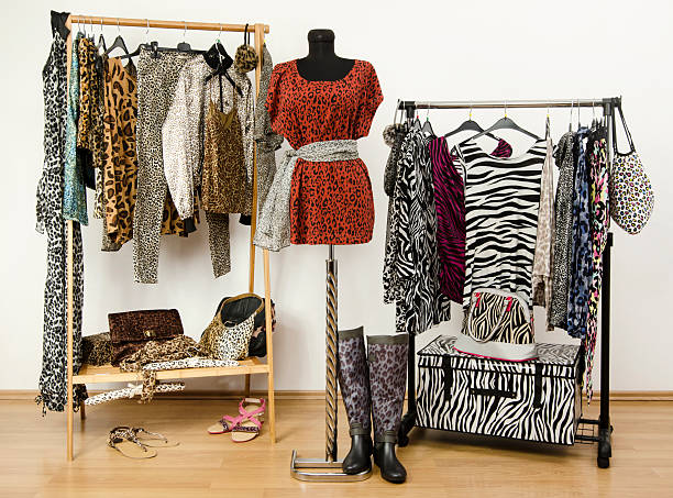 istock Colorful wardrobe with jungle pattern clothes and accessories. 492261595