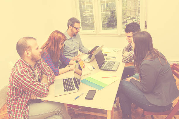 istock Young group of people discussing business plans 492262794