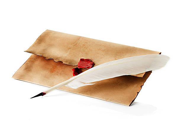 istock old, vintage envelope and quill pen isolated 492263401