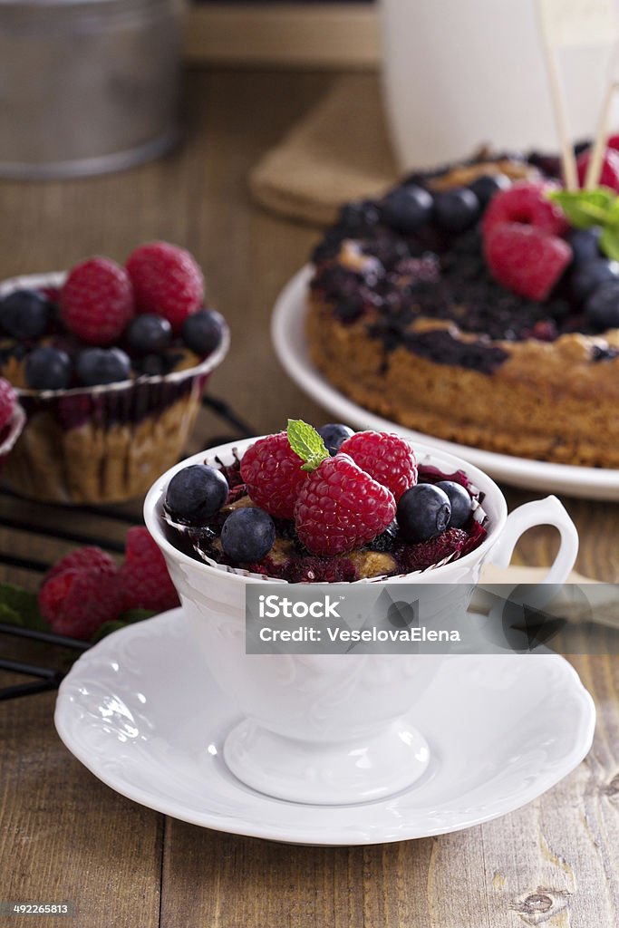 Berry muffin with oats Berry muffin with oats served in a cup with fresh berries Baked Stock Photo