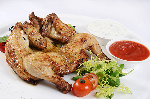 istock The baked hen with salad close-up 492275050