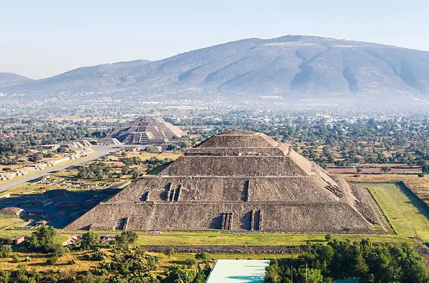 Aerial view of the Pyramids of the Sun and Moon in Teotihuacan, Mexico. In the foreground is the Pyramid of the Sun and the background on the left, the Pyramid of the Moon.