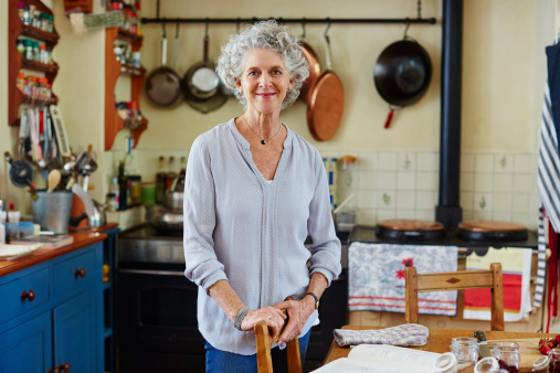 Portrait of smiling senior woman in kitchen