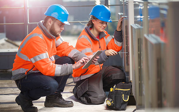 istock female air conditioning technician with her supervisor 492276840