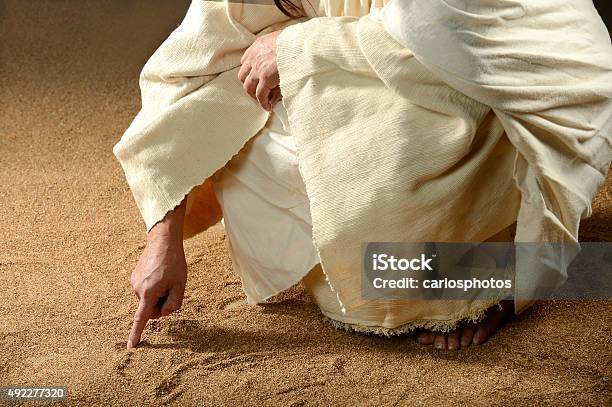 Jesus Writing Won The Sand Stock Photo - Download Image Now - Jesus Christ, God, Son