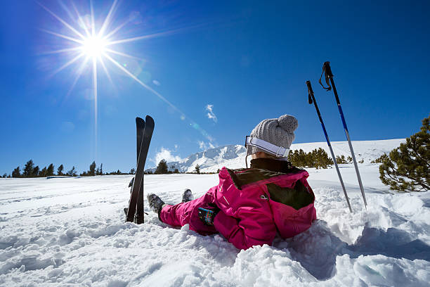 Woman skier enjoy in winter sunny day stock photo