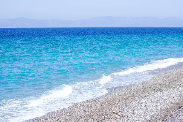 istock azure sea with pebble beach 492282480