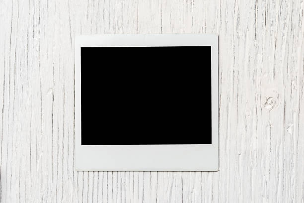 istock Instant photo frame on wooden background 492284286
