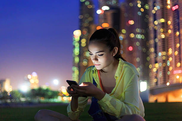 istock Attractive brunette texting on the phone. 492285998