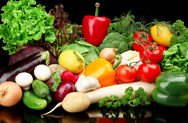 istock Group of different vegetables on black background 492286306