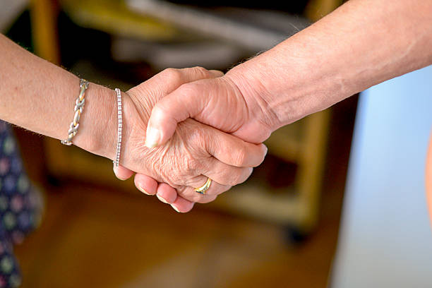 istock Closeup of people shaking hands 492288058