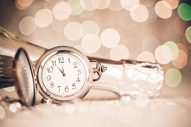 New Year's clock and champagne at midnight