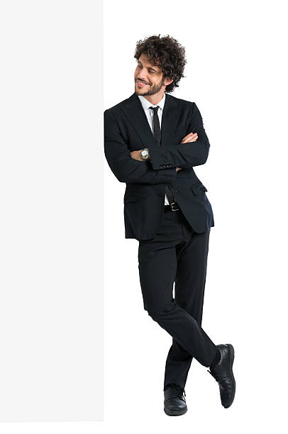 Businessman Looking At Billboard Young Elegant Man With Armcrossed Looking At Billboard Isolated On White Background leaning stock pictures, royalty-free photos & images