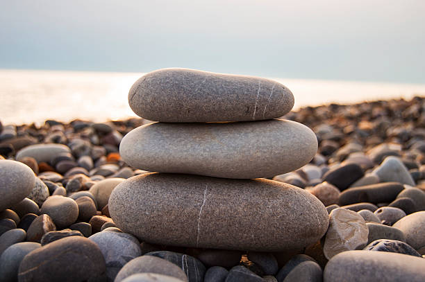 beach pebbles balance stock photo