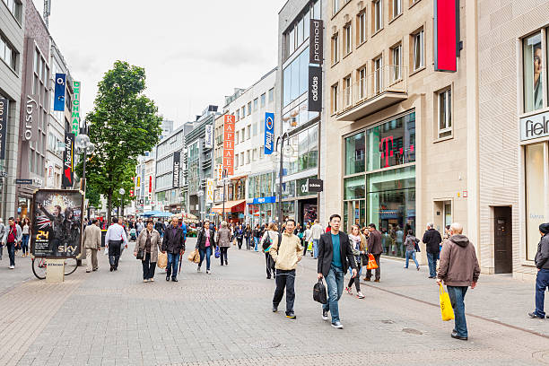 Cologne, Germany - May 7, 2014: Crowded shopping street in Cologne city center on a cloudy day