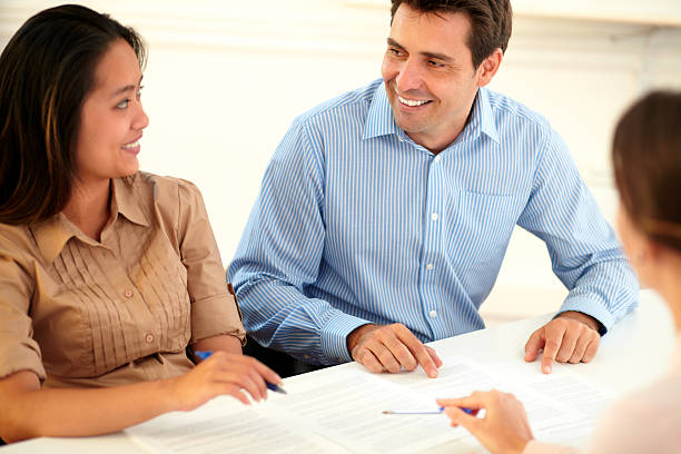 istock Charming couple interested in a contract 492299139