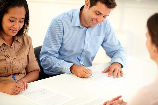 istock Male and female worker signing a contract 492299145