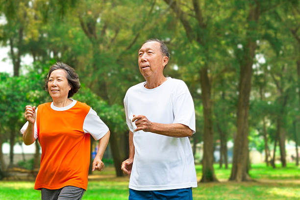 istock happy senior couple running together 492299503