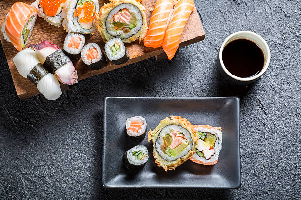istock Sushi served with soy sauce on black stone 492300851