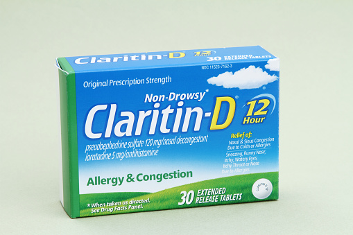 West Palm Beach, USA - May 16, 2014: A product shot of a carton of Claritin-D extended release tablets. Claritin-D is an over the counter medication for the relief of allergy and congestion. Claritin-D combines the allergy relief properties of regular Claritin with pseudoephedrine, a decongestant, making it helpful in relieving the symtoms of colds as well. 