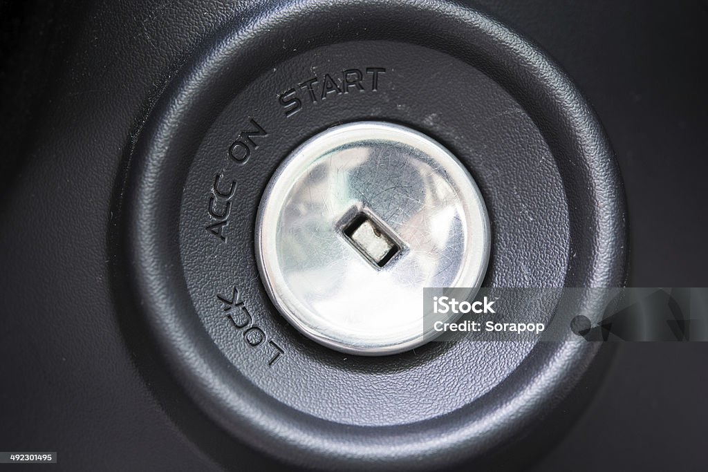 Closeup macro engine start key Closeup macro engine start key hole of a modern car Beginnings Stock Photo