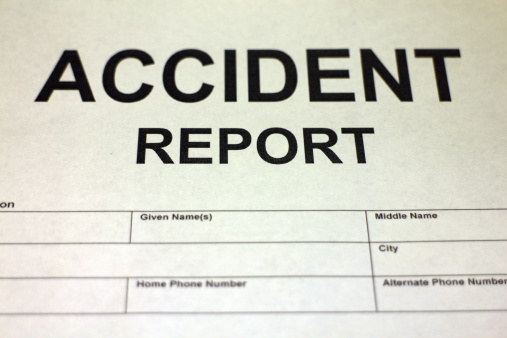 Someone filling out Accident Report Form