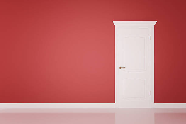 istock Closed white door on green wall 492304189