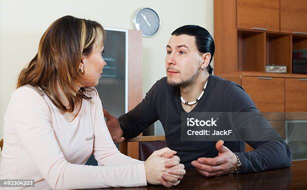 Ordinary Man With Wife Talking Stock Photo - Download Image Now - Adult, Adversity, Arguing