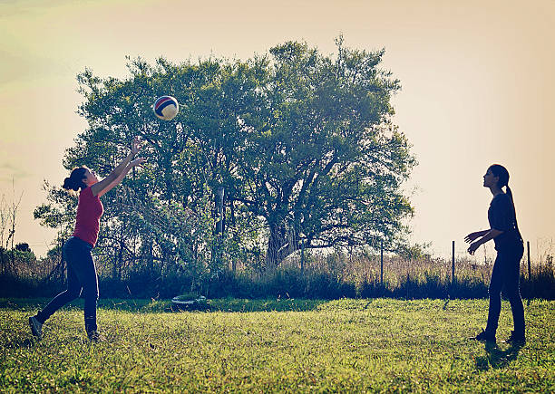 teenagers are playing volleyball in a park in Mar del Plata, Argentina