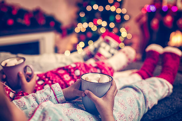 istock Little Kids Sitting in Winter Socks in front Christmas Tree 492310438