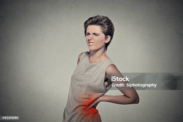 Young Woman With Backache Back Pain Back Colored In Red Stock Photo - Download Image Now