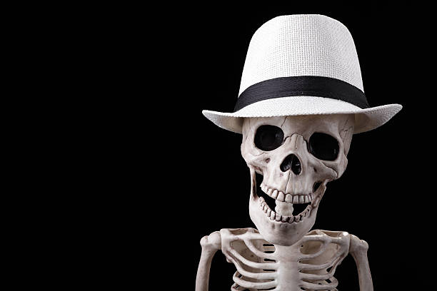 Skeleton wearing white hat stock photo