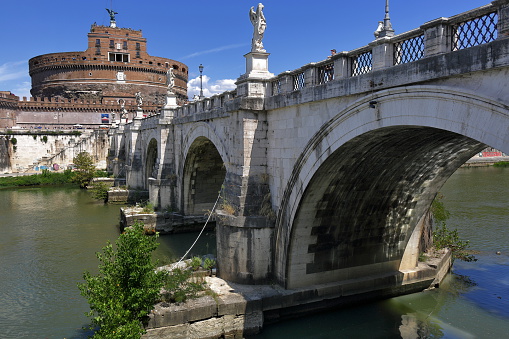 Rome, Italy - August 18, 2015: Castel Sant'Angelo and brige Ponte Sant'Angelo in sunny day against clear blue sky