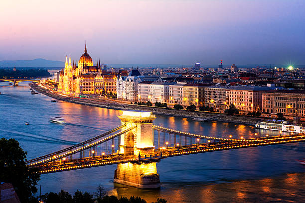 Budapest night lights The Hungarian Parliament and the Chains Bridge in Budapest at sunset. fishermens bastion photos stock pictures, royalty-free photos & images