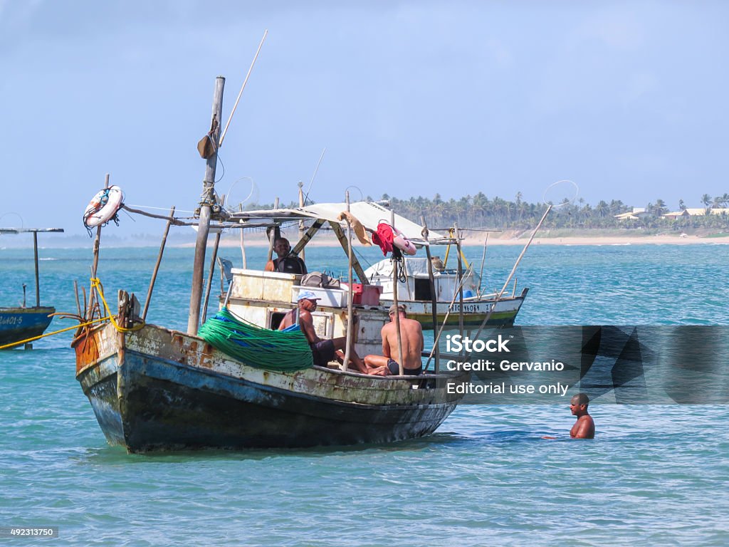 Fishing boats Guarajuba, BA, Brazil - 08 Feb 2013: anchored fishing boat near the beach in the area of common fishing boats due to use of fishing for a living. 2015 Stock Photo