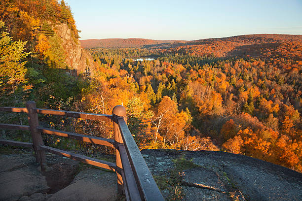istock Trees in fall color, hills and lake viewed from overlook 492315392
