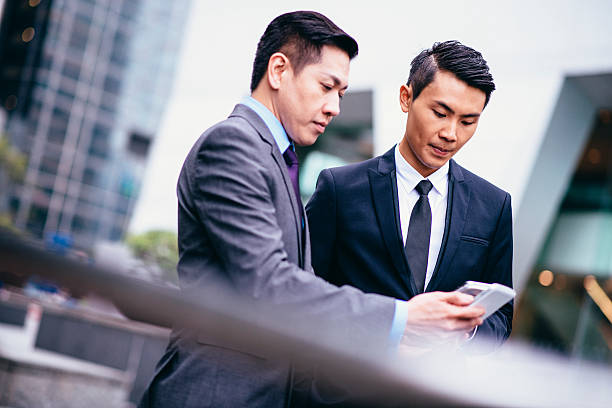 istock Businessmen with Mobile Phone 492316016
