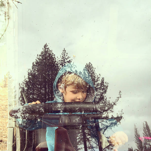 istock Boy pretending to drive a truck 492316098