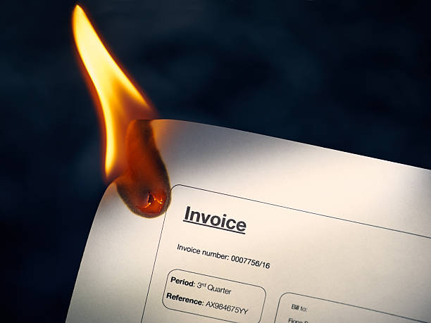 istock Closeup Of Invoice Paper Burning On Fire 492316402
