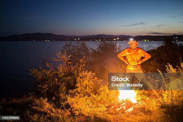 Hiking Tourist Have A Rest In His Camp At Night Stock Photo - Download Image Now - 2015, Activity, Adult