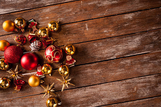 istock Christmas baubles on a wooden table 492320018