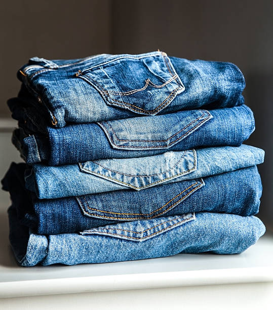 istock Lot of different blue jeans 492320150