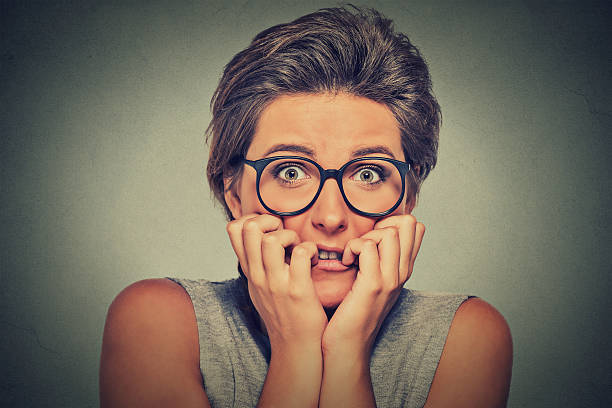 istock nervous stressed anxious woman with glasses 492322564